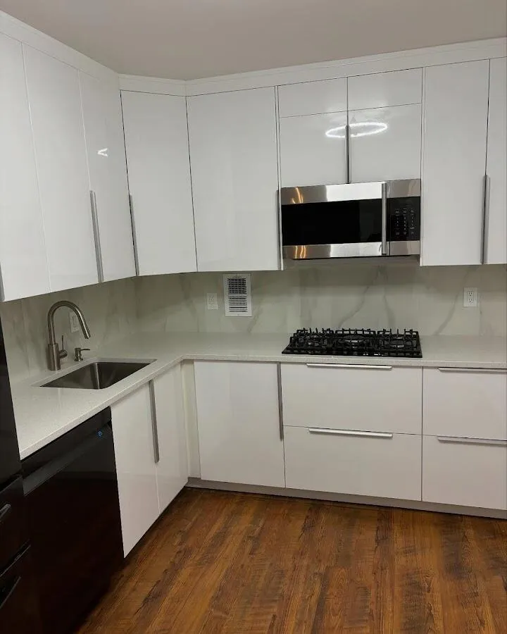 Restored kitchen with white cabinets after water damage in Newington